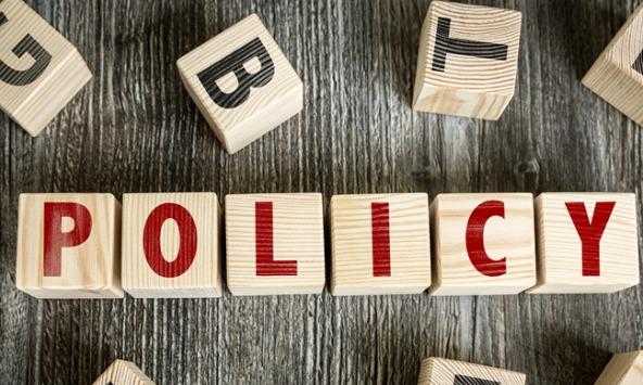 Wooden blocks spelling the word 'policy'
